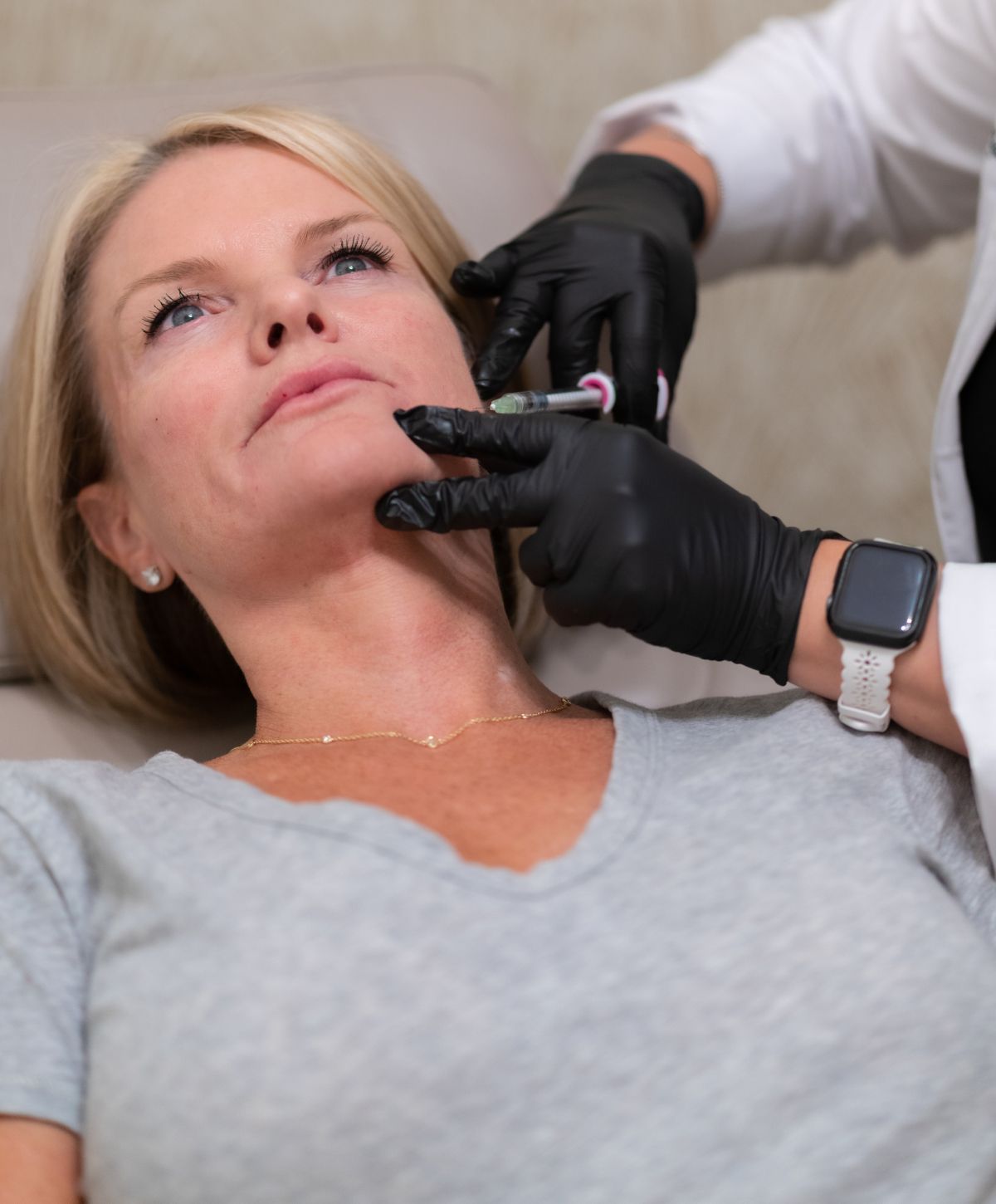 Orange County Dysport client receiving aesthetic treatment in clinic setting.