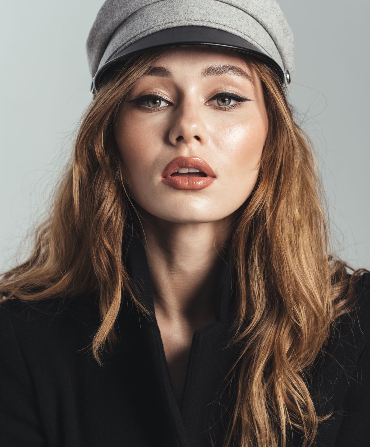 Orange County Radiesse model with long hair wearing a stylish hat.