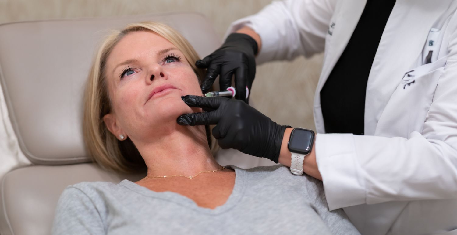 Orange County med spa patient receiving cosmetic treatment at clinic.