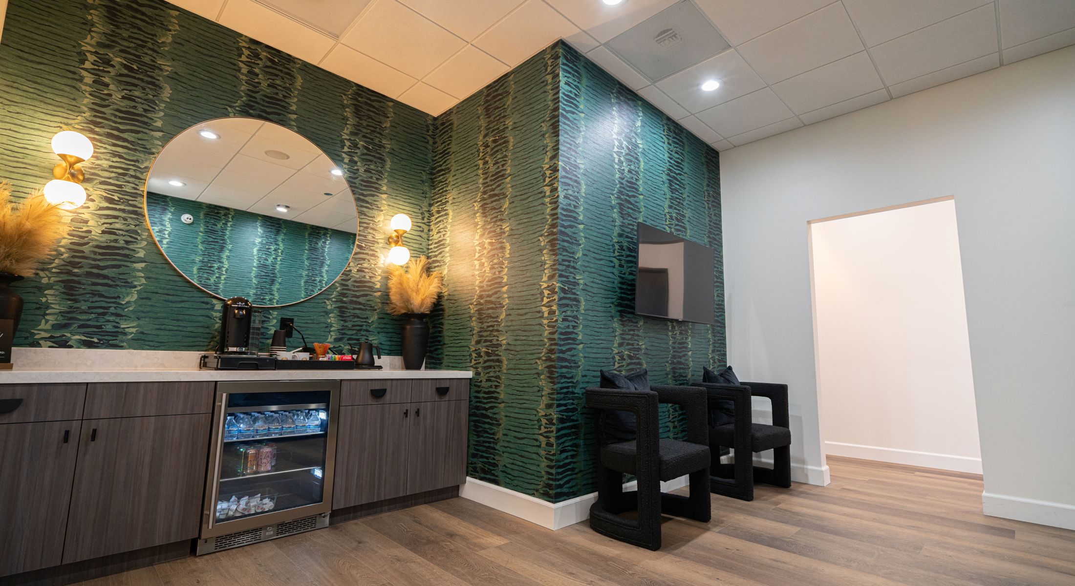 Modern lounge area with stylish decor and furniture.