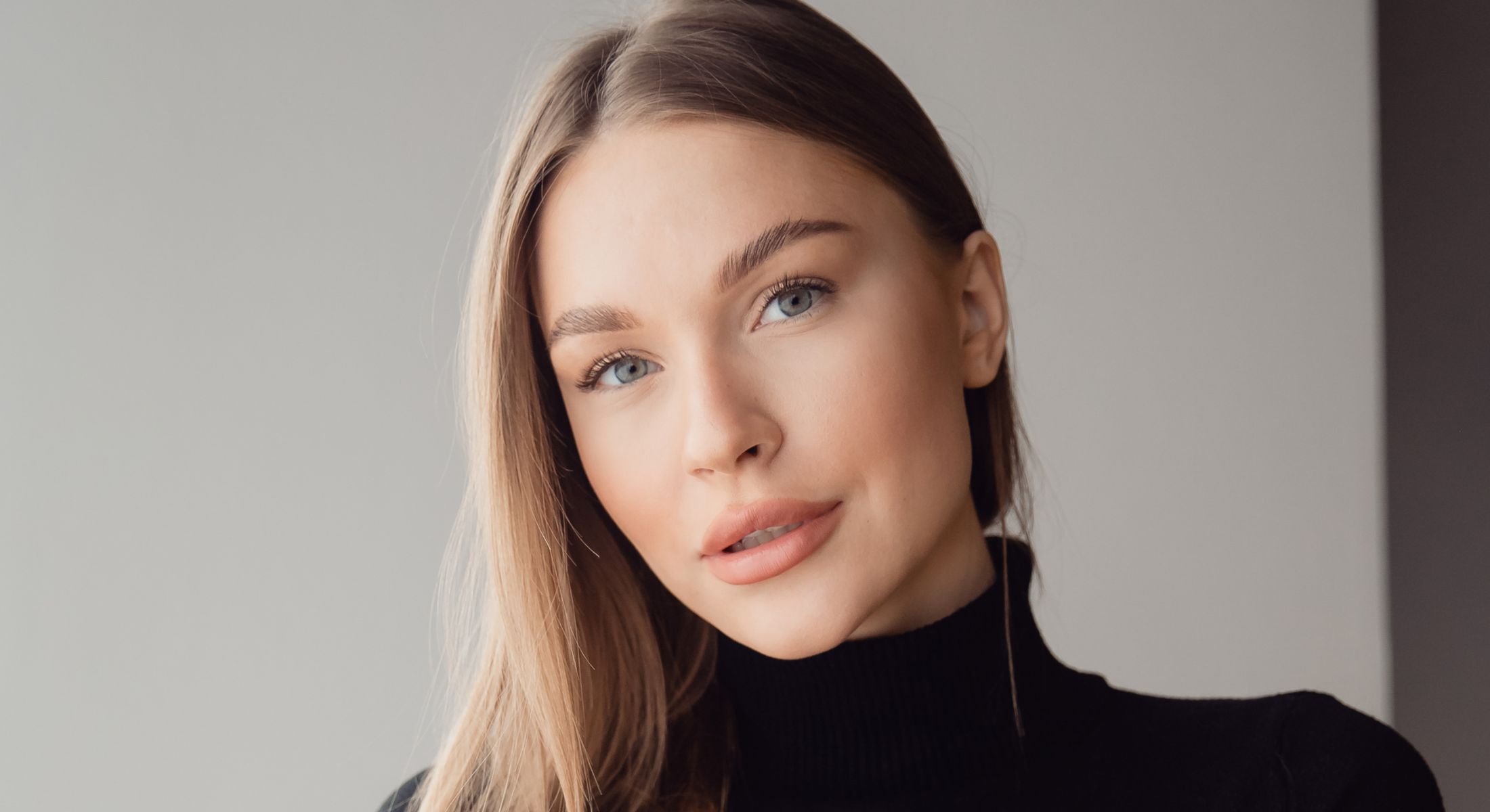Portrait of a woman with long hair.