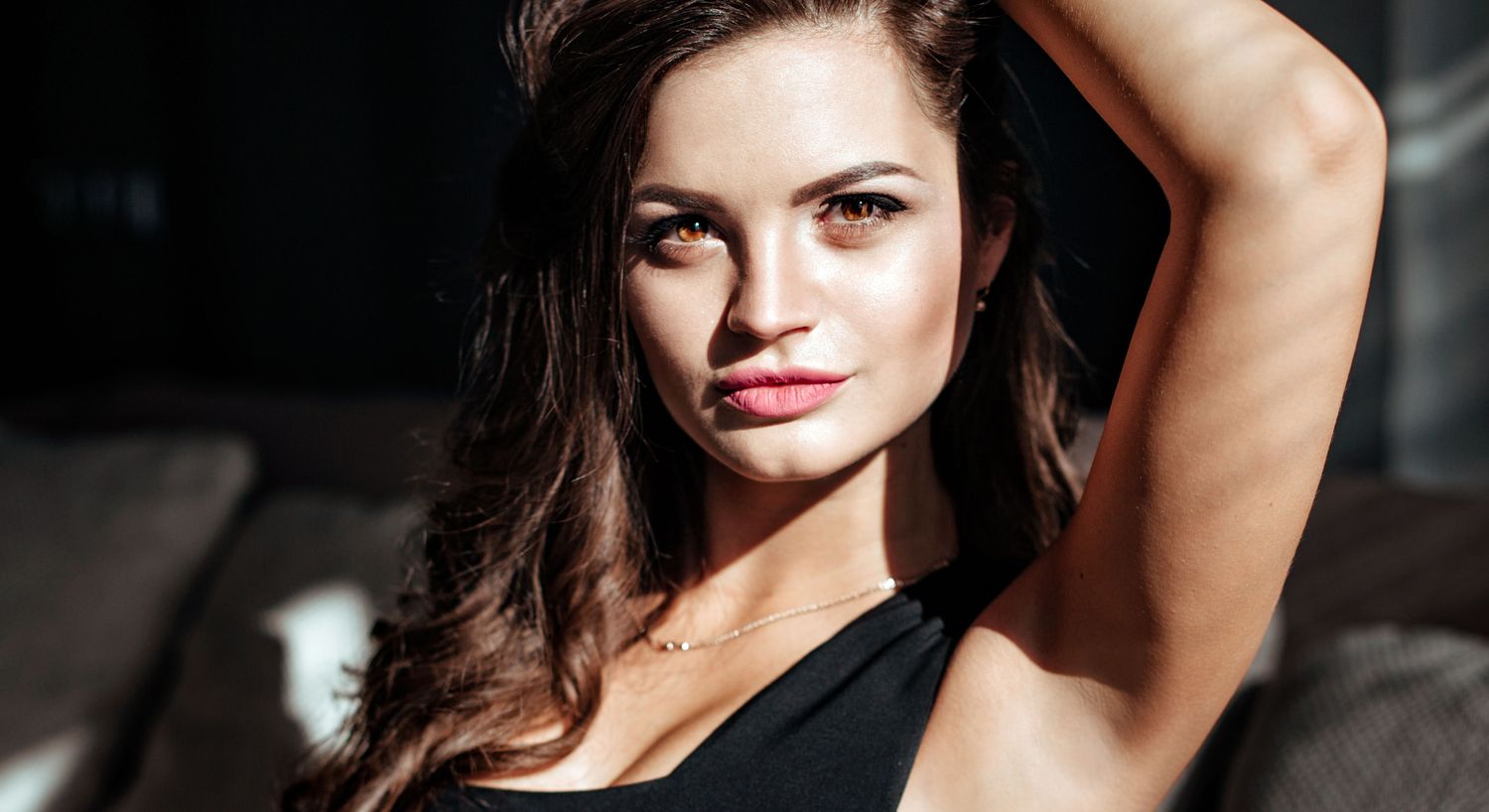 Orange County Dysport model with long hair posing in sunlight.