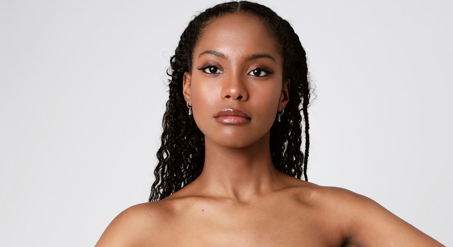 Orange County Restylane model with curly hair and natural makeup.