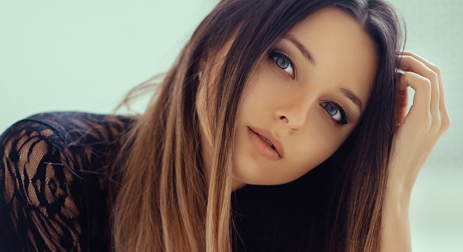 Close-up of an Orange County skin resurfacing model with long hair.